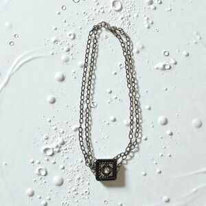 Elegant Silver Necklace with Intricate Pendant